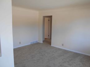 St. Clair Shores house for rent - A room with a carpeted floor and a door.