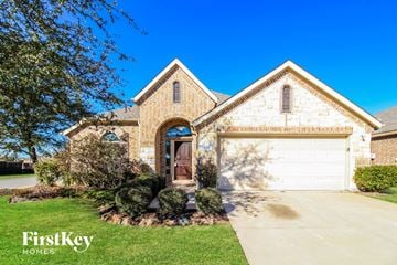 Princeton house for rent - a large brick house with a white garage door