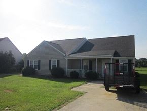Wilson apartment for rent - A house with a truck parked in front.
