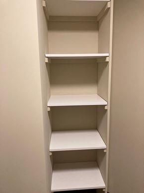 Lincoln house for rent - Empty white shelves in a pantry.