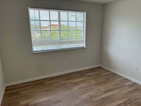 N. Miami apartment for rent - a living room with a large window and wooden floors