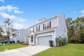 Moncks Corner house for rent - A two-story house with a garage and a driveway.