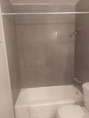 San Bernardino apartment for rent - a bathroom with a toilet and a bath tub