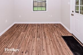 Bartlett house for rent - the living room of a home with wood flooring