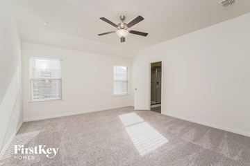 Princeton house for rent - a spacious living room with carpet and a ceiling fan