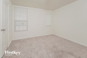 Princeton house for rent - a bedroom with a carpeted floor and two windows