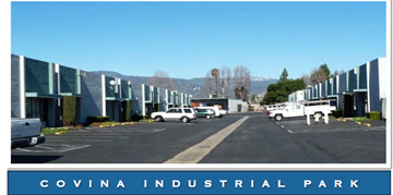 Orange apartment for rent - A large industrial park with a clear blue sky above.