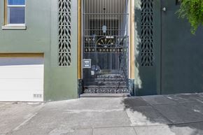 San Francisco apartment for rent - A metal gate with a decorative design is closed.