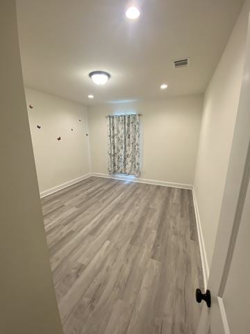 Maurice house for rent - the upstairs living room has hardwood floors and a window with a curtain