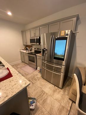 Maurice house for rent - a kitchen with stainless steel appliances and a granite counter top