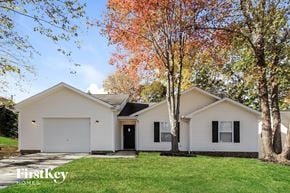 Charlotte house for rent - a white house with a lawn and trees