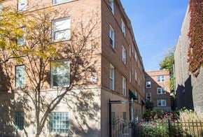 Chicago apartment for rent - Barry Court brick building with a tree in front of it