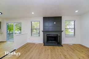 Dublin house for rent - A living room with a fireplace and wooden floors.