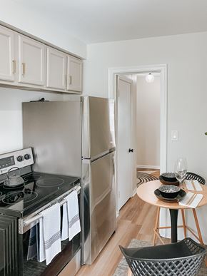 Shaker Heights apartment for rent - a kitchen with stainless steel appliances and a small table