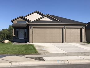 Spokane apartment for rent - a house with a driveway and a garage door