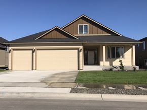 Spokane apartment for rent - a house with a garage door in front of it