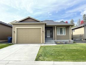 Spokane apartment for rent - a house with a driveway and a garage door