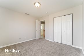 North Port house for rent - a bedroom with two closets and a door to a hallway