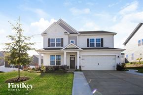 Mooresville house for rent - a white house with a sidewalk in front of it