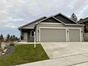 Spokane apartment for rent - a house with a driveway and a garage door