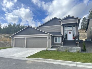 Spokane apartment for rent - a home with a front porch and a garage door