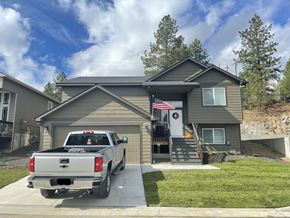 Spokane apartment for rent - a truck parked in the driveway outside of a house