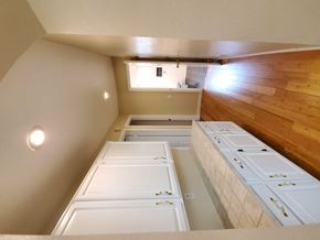Chandler house for rent - an overhead view of a kitchen with white cabinets and a wood floor