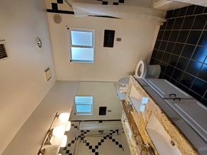 Chandler house for rent - a bathroom with a sink and a toilet and a mirror