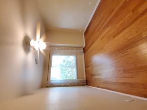 Chandler house for rent - a living room with a wooden wall and a window