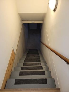 Weston apartment for rent - A staircase with wooden steps and a light on the wall.