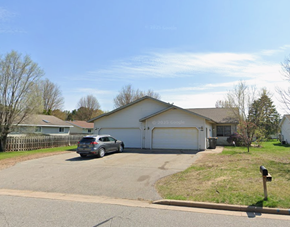 Weston apartment for rent - A car is parked in a driveway in front of a house.