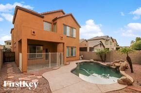 Phoenix house for rent - A house with a pool in the backyard.