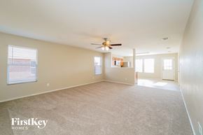 Arlington house for rent - A spacious room with a ceiling fan and carpeted floor.