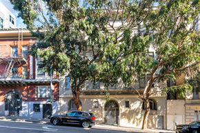 San Francisco apartment for rent - A black car is parked on the side of a street.