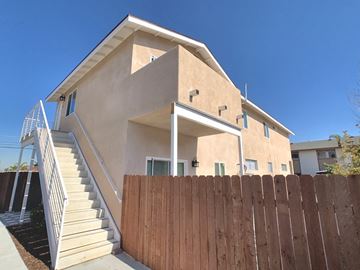 Chula Vista apartment for rent - the front of a house with a wooden fence and stairs