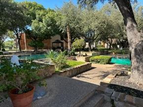San Angelo apartment for rent - a backyard with a swimming pool and trees
