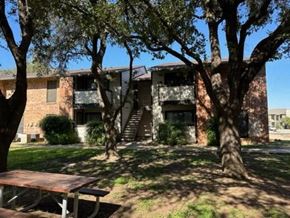 San Angelo apartment for rent - an apartment building with a picnic table in the yard