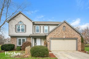 Fishers house for rent - A house with a garage and a driveway is for sale.