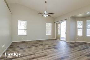 Avondale house for rent - the spacious living room with wood flooring and a ceiling fan