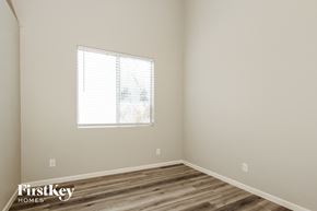 Avondale house for rent - a bedroom with a window and wooden floors