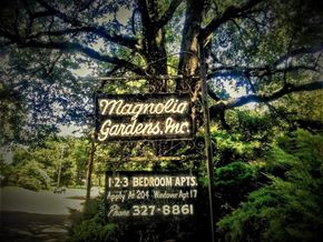 Memphis apartment for rent - a sign for the magnolia gardeners house in front of a tree