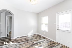 Princeton house for rent - A room with wooden flooring and a white door.