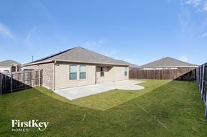 Princeton house for rent - A house with a fence and a grassy yard is for sale.