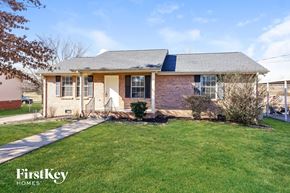 Lebanon house for rent - A brick house with a lawn in front.