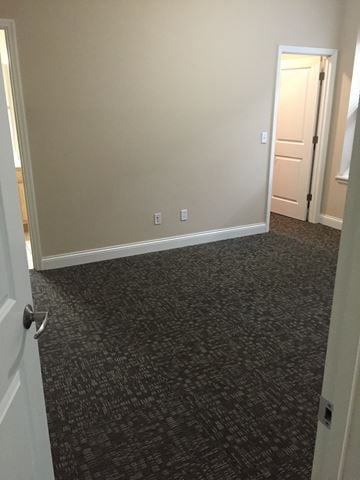 St. Louis apartment for rent - a bedroom with a carpeted hallway and a door to a closet