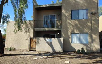 Phoenix apartment for rent - an exterior view of an apartment building with a door and a balcony