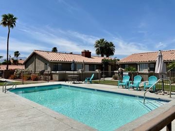 Bermuda Dunes apartment for rent - a swimming pool in front of a house