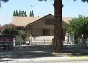 Whittier apartment for rent - A house with a brown roof and a tree in front.
