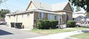 Ontario apartment for rent - a house with trash cans in front of it