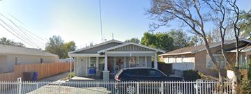 San Bernardino apartment for rent - a car parked in front of a white house